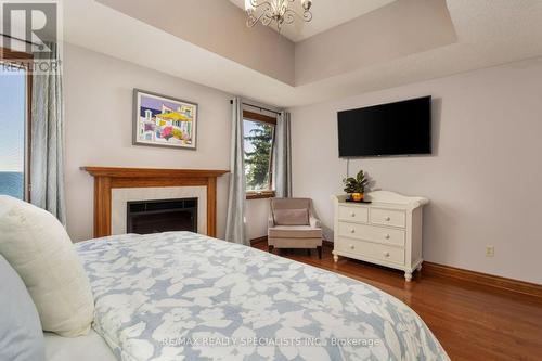 327A Lake Promenade, Toronto, ON - Indoor Photo Showing Bedroom With Fireplace