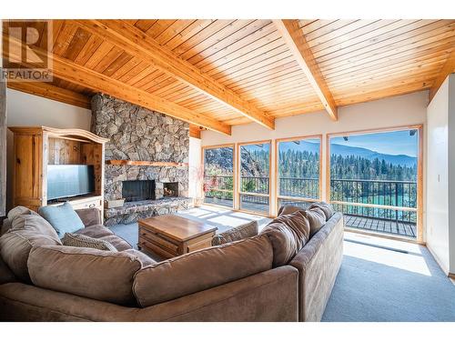 13710 Ponderosa Way, Coldstream, BC - Indoor Photo Showing Living Room With Fireplace