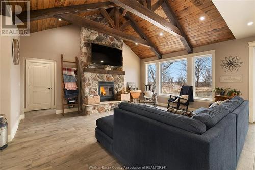 21227 Hodovick Road, Wheatley, ON - Indoor Photo Showing Living Room With Fireplace