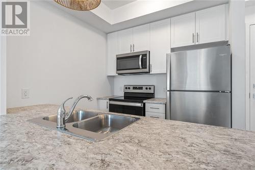 229 - 460 Dundas Street E, Hamilton, ON - Indoor Photo Showing Kitchen With Stainless Steel Kitchen With Double Sink