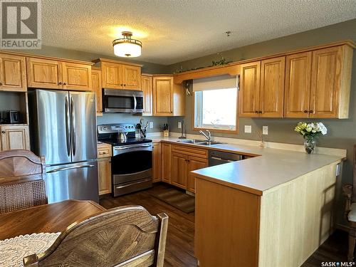 304 11 Coteau Avenue W, Weyburn, SK - Indoor Photo Showing Kitchen With Double Sink