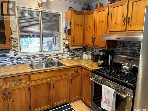 414 Moosoomina Crescent, Lac La Ronge, SK - Indoor Photo Showing Kitchen With Double Sink