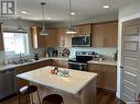 126 Wheatland Court, Rosthern, SK  - Indoor Photo Showing Kitchen With Double Sink 