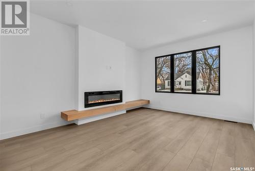 107 4Th Street E, Saskatoon, SK - Indoor Photo Showing Living Room With Fireplace