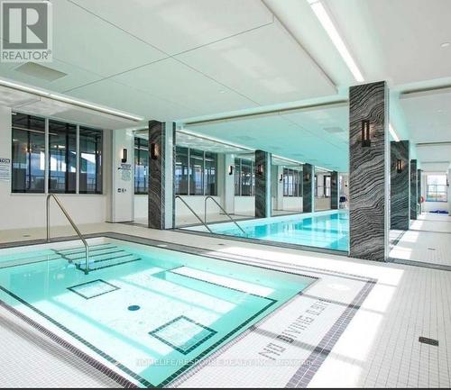 4709 - 30 Shore Breeze Drive, Toronto, ON - Indoor Photo Showing Other Room With In Ground Pool