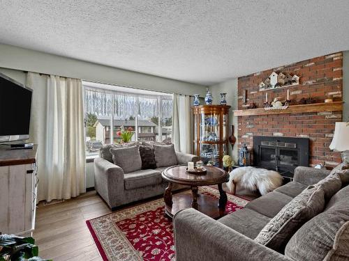 2299 Cleasby Street, Merritt, BC - Indoor Photo Showing Living Room With Fireplace
