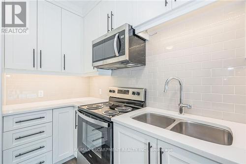 307 - 332 Gosling Gardens, Guelph, ON - Indoor Photo Showing Kitchen With Double Sink