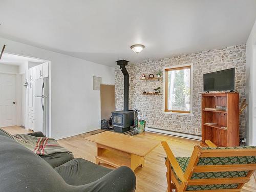 Living room - 246 Ch. Du Lac-Des-Sables, Sainte-Agathe-Des-Monts, QC - Indoor With Fireplace