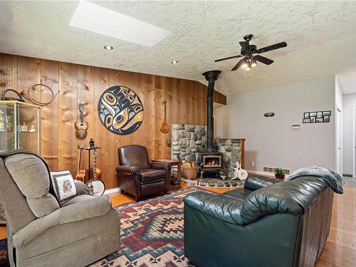 124 Baynes Dr, Bowser, BC - Indoor Photo Showing Living Room With Fireplace