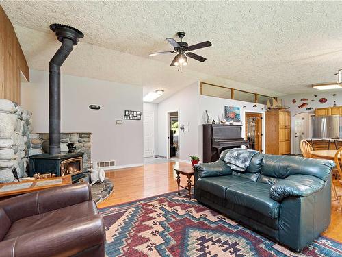 124 Baynes Dr, Bowser, BC - Indoor Photo Showing Living Room With Fireplace