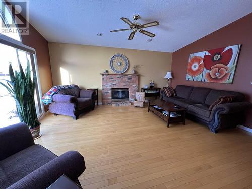 5504 Churchill Avenue, Fort Nelson, BC - Indoor Photo Showing Living Room With Fireplace