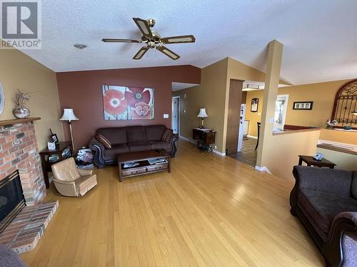 5504 Churchill Avenue, Fort Nelson, BC - Indoor Photo Showing Living Room With Fireplace
