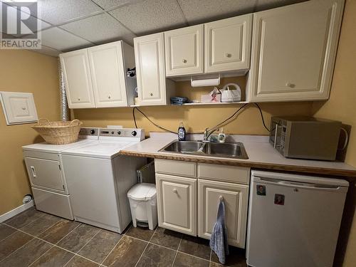 5504 Churchill Avenue, Fort Nelson, BC - Indoor Photo Showing Laundry Room