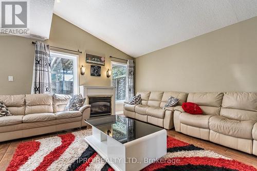 94 Queen Charlotte Crescent, Kitchener, ON - Indoor Photo Showing Living Room With Fireplace