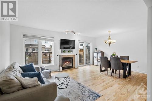 450 Grey Seal Circle, Ottawa, ON - Indoor Photo Showing Living Room With Fireplace
