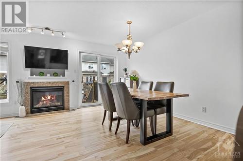 450 Grey Seal Circle, Ottawa, ON - Indoor Photo Showing Dining Room With Fireplace