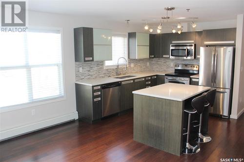 202 1510 Neville Drive, Regina, SK - Indoor Photo Showing Kitchen With Stainless Steel Kitchen With Double Sink With Upgraded Kitchen
