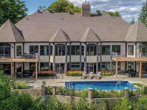 Back facade - 1485 Rue Des Quatre-Saisons, Sainte-Adèle, QC - Outdoor With In Ground Pool