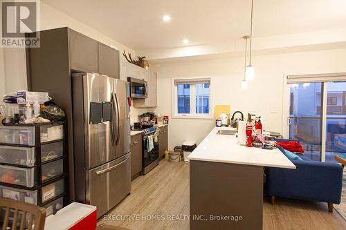 104 - 1781 Henrica Avenue N, London, ON - Indoor Photo Showing Kitchen With Stainless Steel Kitchen With Double Sink