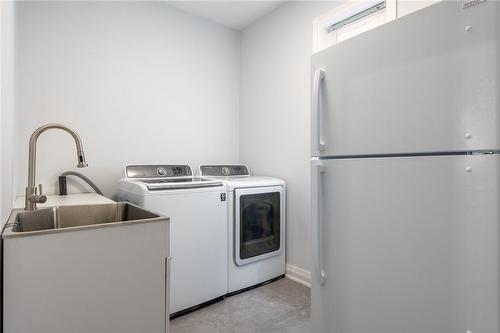 MAIN FLOOR LAUNDRY - 107 Raymond Road, Ancaster, ON - Indoor Photo Showing Laundry Room