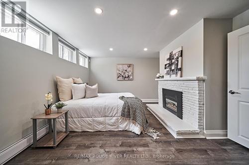 75A Heale Avenue, Toronto, ON - Indoor Photo Showing Bedroom With Fireplace