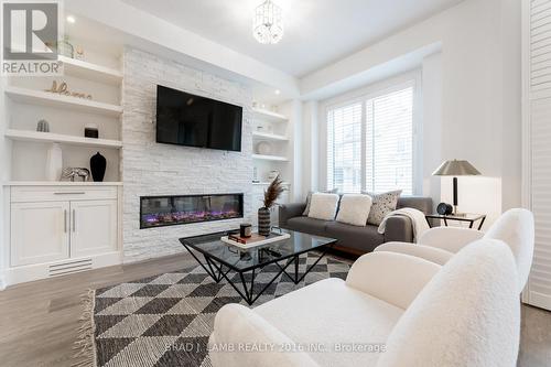 384 Alderwood Common, Oakville, ON - Indoor Photo Showing Living Room With Fireplace