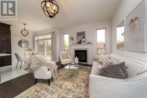 65 Allegra Drive, Wasaga Beach, ON - Indoor Photo Showing Living Room With Fireplace