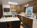 1400 1St Street N, Swan River, MB  - Indoor Photo Showing Kitchen With Double Sink 