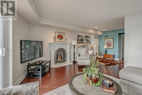 10 - 2136 Old Lakeshore Road, Burlington, ON - Indoor Photo Showing Living Room With Fireplace