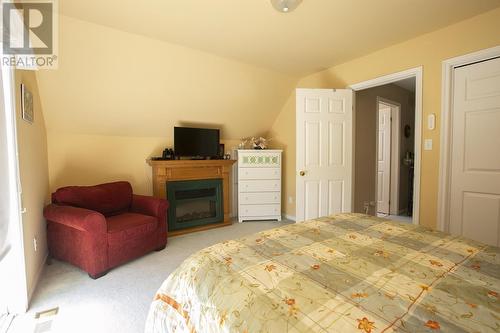 4 Prout St, Bruce Mines, ON - Indoor Photo Showing Bedroom With Fireplace