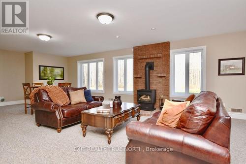 1524 Flos 8 Road E, Springwater, ON - Indoor Photo Showing Living Room With Fireplace