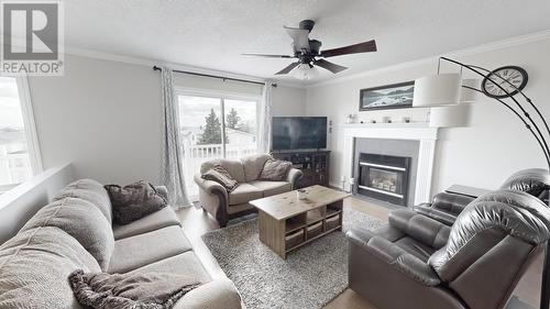 8308 90 Avenue, Fort St. John, BC - Indoor Photo Showing Living Room With Fireplace
