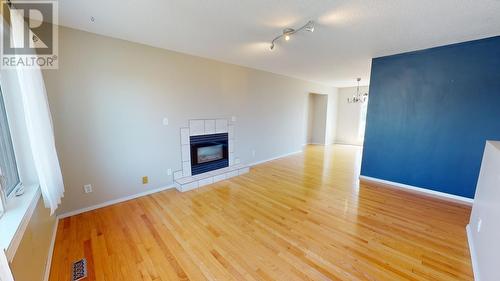 9715 91 Street, Fort St. John, BC - Indoor Photo Showing Other Room With Fireplace