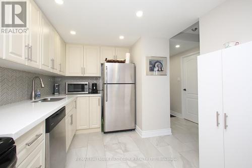 505 - 20 Dean Park Road, Toronto, ON - Indoor Photo Showing Kitchen With Double Sink