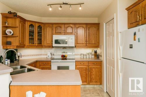 9730 174 St Nw, Edmonton, AB - Indoor Photo Showing Kitchen With Double Sink