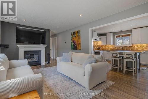 104 Bass Line, Oro-Medonte, ON - Indoor Photo Showing Living Room With Fireplace
