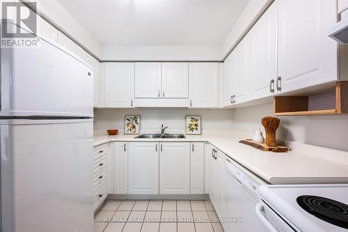101 - 245 Queen Street W, Centre Wellington, ON - Indoor Photo Showing Kitchen With Double Sink