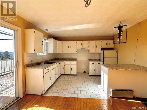 54 Cormier Street, Edmundston, NB - Indoor Photo Showing Kitchen With Double Sink