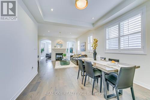 117 Wheat Boom Drive, Oakville, ON - Indoor Photo Showing Dining Room With Fireplace