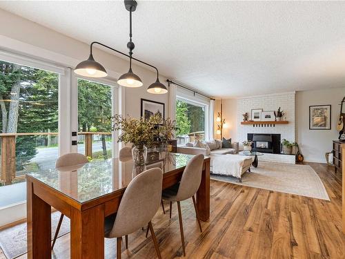 2720 Labieux Rd, Nanaimo, BC - Indoor Photo Showing Dining Room With Fireplace