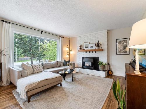 2720 Labieux Rd, Nanaimo, BC - Indoor Photo Showing Living Room With Fireplace