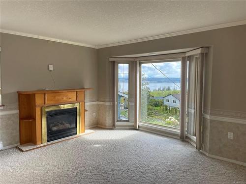 338 Woodland Cres, Port Mcneill, BC - Indoor Photo Showing Living Room With Fireplace