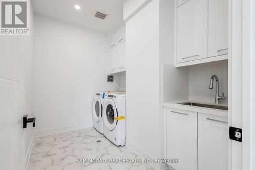 73 Elma Street, Toronto, ON - Indoor Photo Showing Laundry Room