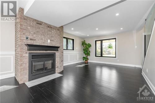 9088 Mitch Owens Road, Ottawa, ON - Indoor Photo Showing Living Room With Fireplace