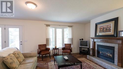 179 Westpoint Sands Road, Huntsville, ON - Indoor Photo Showing Living Room With Fireplace