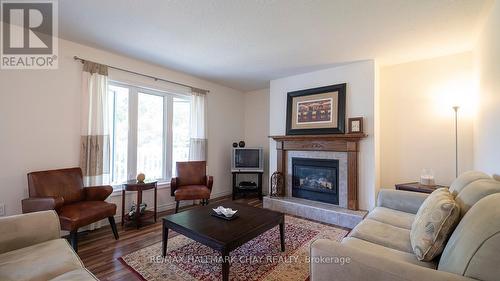 179 Westpoint Sands Road, Huntsville, ON - Indoor Photo Showing Living Room With Fireplace