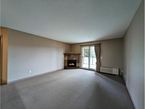 106 - 4874 Stanley Street, Radium Hot Springs, BC - Indoor With Fireplace