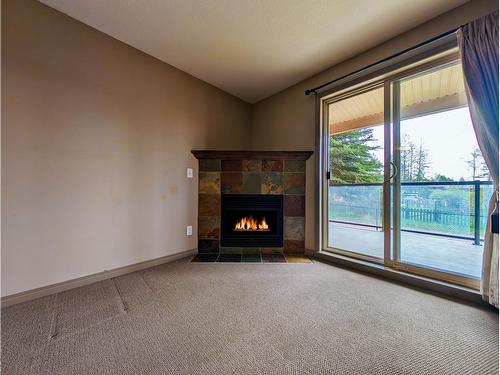 106 - 4874 Stanley Street, Radium Hot Springs, BC - Indoor With Fireplace