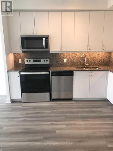 512 - 3220 Sheppard Avenue E, Toronto, ON - Indoor Photo Showing Kitchen With Stainless Steel Kitchen