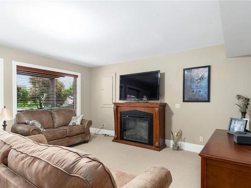 580 Island Hwy, Campbell River, BC - Indoor Photo Showing Living Room With Fireplace